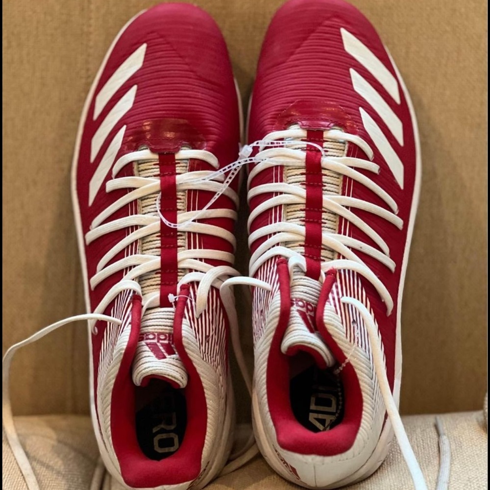 Red Adidas metal cleats